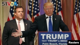 Republican U.S. presidential candidate Donald Trump, with former rival candidate Governor Chris Christie, left, at his side, speaks at a news conference in Palm Beach, Fla., March 1, 2016. 
