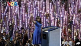 First Lady Michelle Obama waves as she speaks to delegates during the first day of the Democratic National Convention in Philadelphia , Monday, July 25, 2016. (AP Photo/Matt Rourke)