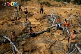 Indigenous people from the Mura tribe show a deforested area in unmarked indigenous lands inside the Amazon rainforest near Humaita, Amazonas State, Brazil August 20, 2019. Picture taken August 20, 2019. REUTERS/Ueslei Marcelino