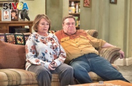 In this image released by ABC, Roseanne Barr, left, and John Goodman appear in a scene from the reboot of 