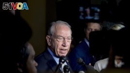 Senate Judiciary Committee Chairman Chuck Grassley, R-Iowa, speaks to reporters on Capitol Hill, Wednesday, Sept. 19, 2018, in Washington.