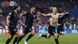 Croatia's Domagoj Vida, right, celebrates with his teammates after scoring his side's second goalduring the quarterfinal match between Russia and Croatia at the 2018 soccer World Cup.