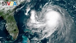This OES-16 East GeoColor satellite image taken Friday, Aug. 20, 2021, at 11:40 a.m. EDT., and provided by NOAA, shows Tropical Storm Henri in the Atlantic Ocean. Henri was expected to intensify into a hurricane by Saturday, the U.S. National...