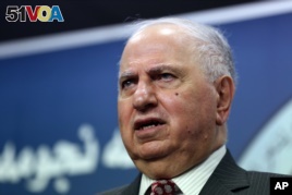 Ahmed Chalabi speaks to the media in Baghdad, Tuesday, July 15, 2014.