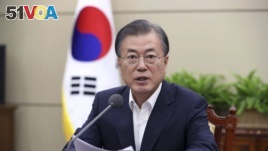 South Korean President Moon Jae-in speaks during a meeting with his senior aides at the presidential Blue House in Seoul, South Korea, Monday, Aug. 5, 2019. 