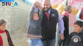 Mohamed Khairullah visits Atmah Refugee camp in 2014 (Photo: Courtesy Mohamed Khairullah)