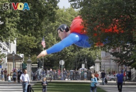 A giant inflatable Superman flies past the U.S. embassy on Balloon Day Parade in Brussels, Sept. 2013.
