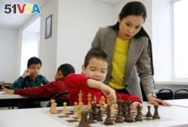Dinara Saduakassova, a 23-year-old Kazakh chess player and social activist, teaches children in the Chess Academy she founded in Nur-Sultan, Kazakhstan March 3, 2020. Saduakassova has opened a chain of chess schools in the country and has become a Goodwill Ambassador of the UNICEF. Picture taken March 3, 2020. REUTERS/Pavel Mikheyev