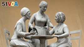 This Oct. 6, 2019 photo provided by Michael Bergmann shows a one-third scale clay model of Sojourner Truth, left, Susan B. Anthony, center, and Elizabeth Cady Stanton at Meredith Bergmann's studio in Ridgefield, Connecticut.(Michael Bergmann via AP)