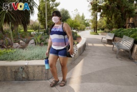 Arizona State University political science major Betzabel Ayala poses for a photo on campus Tuesday, Sept. 8, 2020, in Tempe, Ariz. Because of the coronavirus, Ayala is one of hundreds of thousands of off-campus U.S. college students who are being counted