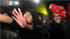 Audience members in Washington, D.C. dance to songs by Caique Vidal, who performed at Tropicalia during Carnaval.