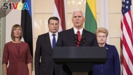 U.S. Vice President Mike Pence and the leaders of Baltic states—Estonian President Kersti Kaljulaid, Latvian President Raimonds Vejonis and Lithuanian President Dalia Grybauskaite (from left to right). AP Photo/Mindaugas Kulbis.
