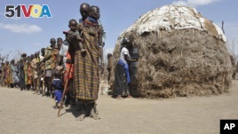 Turkana people wait in a line to receive food from Oxfam in central Turkana district, Kenya in August 2011. The U.N. says tens of thousands of people died in Somalia, Kenya, Ethiopia and Djibouti from famine. Five years later, drought has returned. 