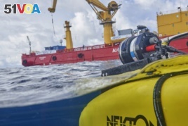 The manned submersible emerges from the water after a dive off the coast of the island of St. Joseph in the Seychelles, Monday April 8, 2019. For more than a month researchers from Nekton, a British-led scientific research group.
