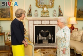 Queen Elizabeth II speaks with Theresa May, left, at the start of an audience in Buckingham Palace, London, where she invited the former Home Secretary to become Prime Minister and form a new government, Wednesday July 13, 2016.
