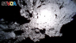 This Oct. 26, 2018, image captured by Rover-1A, and provided by the Japan Aerospace Exploration Agency (JAXA) on Thursday, Dec. 13, 2018, shows the surface of asteroid Ryugu. (JAXA via AP)