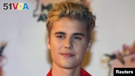 FILE - Canadian singer Justin Bieber arrives for the NRJ Music Awards ceremony at the Festival Palace in Cannes, France.