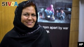 Afghan refugee teacher Aqeela Asifi won a major UN prize and $100,000 to continue teaching refugee Afghan girls in Pakistan. (AP Photo/Anjum Naveed)
