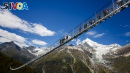 Opening of the world's longest pedestrian suspended bridge (494m) on the Europaweg in Randa, Switzerland, Saturday July 29, 2017. (PHOTOVF/Valentin Flauraud via Zermatt Tourism)