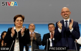 COP 24 President Michal Kurtyka and Executive Secretary of the UN Framework Convention on Climate Change Patricia Espinosa react after adopting the final agreement during a closing session of the COP24 U.N. Climate Change Conference 2018 in Katowice, Poland.