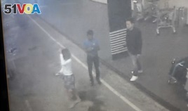 This image provided by Star TV of closed circuit television footage from Feb. 13, 2017, shows a woman, left, at Kuala Lumpur International Airport in Sepang, Malaysia, who police say was arrested Wednesday in connection with the death of Kim Jong Nam.