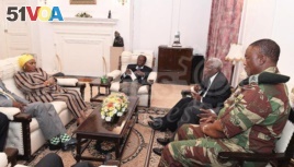 President Robert Mugabe, center, in a meeting with the ZDF Commander General Constantino Chiwenga, South African Minister of Defense Nosiviwe Mapisa-Nqakula (in yellow head wear), Zimbabwe Defense Minister Dr Sydney Sekeramayi and Zimbabwe State Security