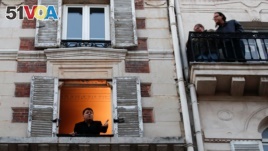 Keeping windows open can help move good air in and bad out. Here, French singer Stephane Senechal sings from his apartment's open window in Paris. A lockdown was imposed to slow the rate of the coronavirus disease (COVID-19) spread, March 24, 2020. REUTERS/Gonzalo Fuentes