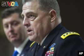 Army Undersecretary Patrick Murphy listens at left as Army Chief of Staff Gen. Mark Milley testifies on Capitol Hill in Washington before the Senate Armed Services Committee hearing.