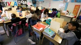 In this April 18, 2014 file photo, students are shown in a fourth-grade classroom at Olympic View Elementary School in Lacey, Washington. (AP Photo/Ted S. Warren)