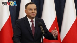 FILE - Poland's President Andrzej Duda speaks at a news conference in Warsaw, Poland, Dec. 20, 2017.