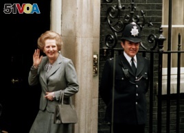 FILE - In this May 11, 1987 file photo, Britain's Prime Minister Margaret Thatcher waves to members of the media on returning to No. 10 Downing Street from Buckingham Palace after a visit with Queen Elizabeth II.