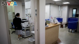 A staff member is seen at a urology clinic as the spread of the coronavirus disease continues in Urawa, north of Tokyo, Japan May 22, 2020. (REUTERS/Issei Kato)