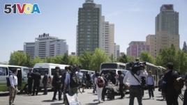 Foreign journalists leave a venue after being told that coverage plans had changed until further notice in Pyongyang, North Korea, May 8, 2016.