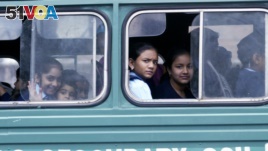 FILE - Kenyan students ride the bus to their school, Jan. 14, 2008.
