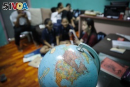 Christian Burmese refugees sit in a classroom in Kuala Lumpur, Malaysia, M arch 11, 2017.