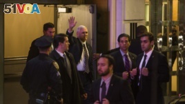  Vice President-elect Mike Pence (top center) leaves the Richard Rodgers Theatre after a performance of 
