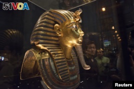The mask of King Tutankhamun, which was found to have been damaged and glued back together, is seen at the Egyptian Museum in Cairo, Jan. 24, 2015. 