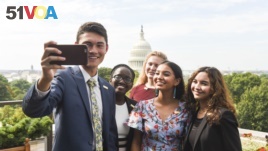 The newly-appointed 2017 Class of National Student Poets, from left, Ben Lee, Juliet Lubwama, Annie Castillo, Kinsale Hueston, and Camila Sanmiguel celebrate with a selfie on the rooftop balcony at the Library of Congress on Thursday, Aug. 31, 2017.