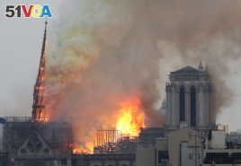 Flames rise from NoFlames rise from Notre Dame cathedral as it burns in Paris, Monday, April 15, 2019. Its tall, narrow spire later collapsed.