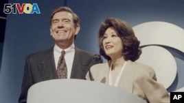 Dan Rather and Connie Chung share the podium at a news conference in New York, May 17, 1993 where it was announced Chung will join Rather as co-anchor of the 