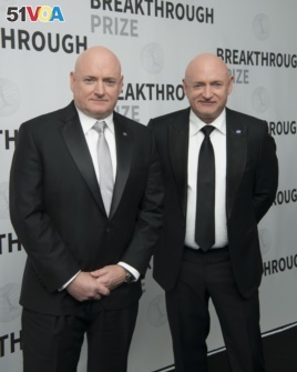 Astronauts Scott Kelly, left, and Mark Kelly backstage at the fIfth annual Breakthrough Prize Ceremony on Sunday, Dec. 4, 2016 at the NASA Ames Research Center in Mountain View, Calif.