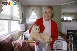Mary Derr, 93, with her robot cat she calls 