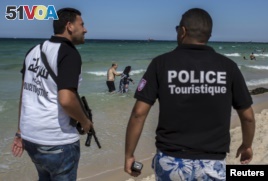 Tourist police officers patrol at the beach  in Sousse, Tunisia, July 1, 2015. 