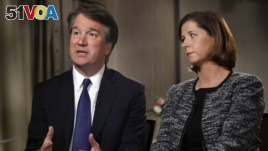 Brett Kavanaugh, with his wife Ashley Estes Kavanaugh, answers questions during a FOX News interview, Sept. 24, 2018, in Washington, about allegations of sexual misconduct against the Supreme Court nominee. 