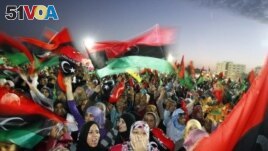  File - In this Sunday Oct. 23, 2011 file photo, Libyan celebrate at Saha Kish Square in Benghazi, Libya.
