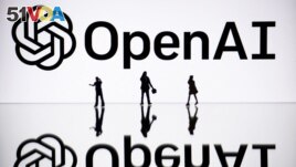 FILE - This illustration photograph taken on October 30, 2023, in Mulhouse, eastern France, shows figurines next to a screen displaying a logo of OpenAI. (Photo by SEBASTIEN BOZON / AFP)