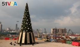 FILE PHOTO A Christmas tree with names of those who died during Beirut port explosion, is seen near the damaged grain silo, in Beirut, Lebanon December 22, 2020. REUTERS/Mohamed Azakir