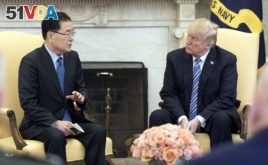South Korea's national security chief Chung Eui-yong briefs U.S. President Donald Trump at the Oval Office about his visit to North Korea, in Washington, March 8, 2018.