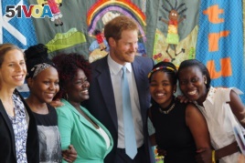 Britain's Prince Harry was among other famous people who spoke at the conference, 2016. He is pictured with young AIDS Ambassadors. (AP Photo)