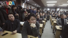 South Korean owners who run factories in the suspended inter-Korean Kaesong Industrial Complex, attend an emergency meeting held by the council of South Korean companies operating in the industrial park, in Seoul, South Korea, Friday, Feb. 12, 2016.